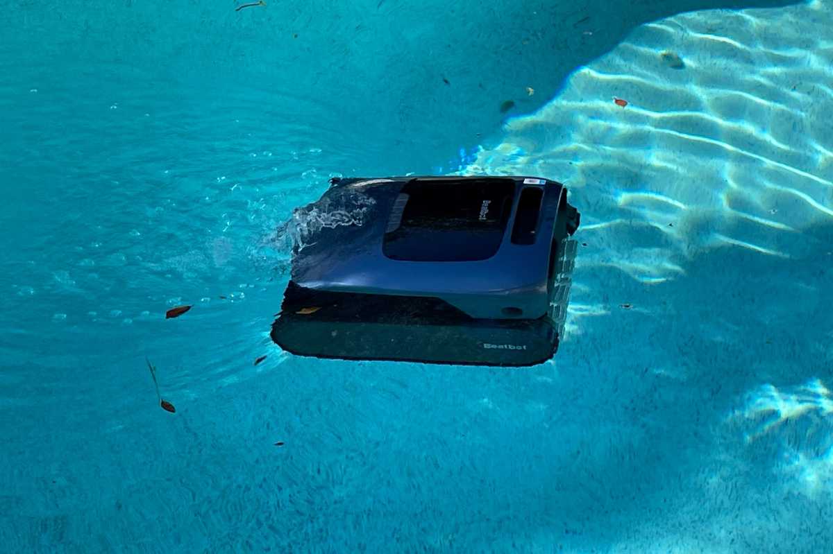 Beatbot AquaSense Pro skimming surface of a pool