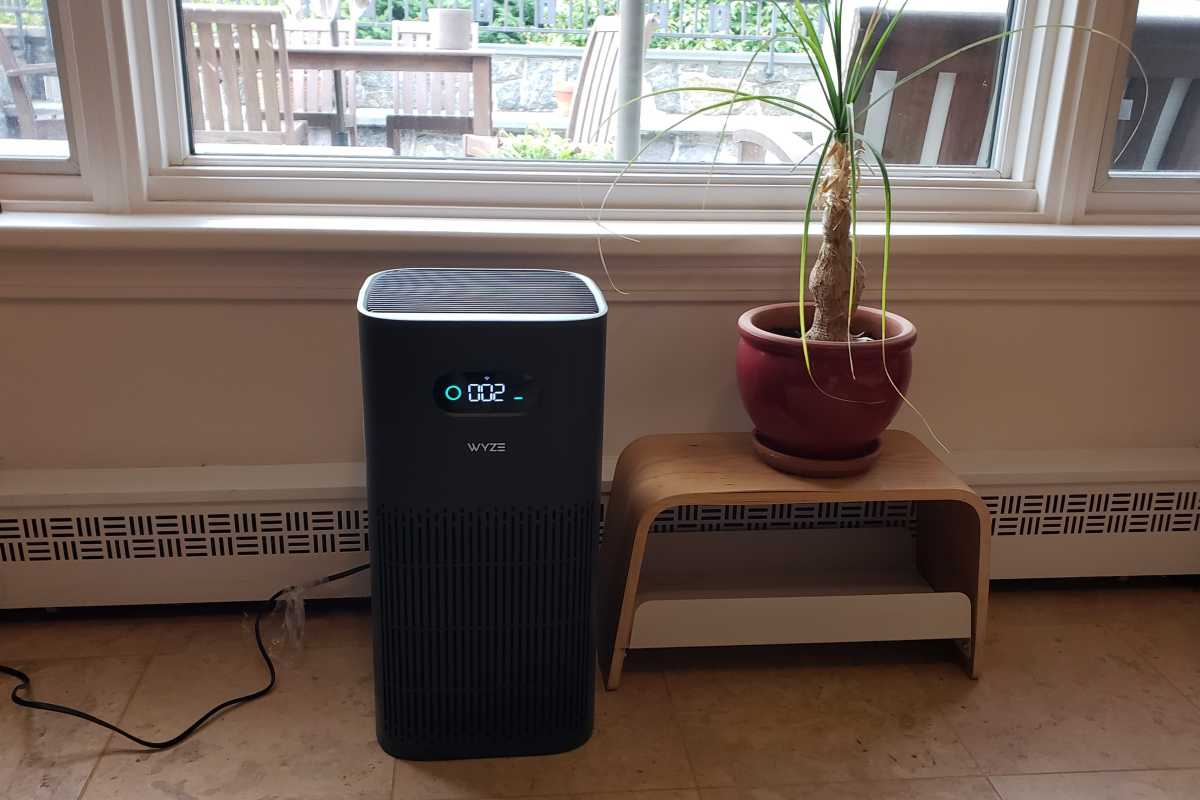 Wyze Air Purifier sitting next to plant